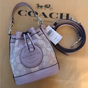 Coach Mini Dempsey Bucket Bag
In Sig. Jacquard With Stripe & Coach Patch NWT